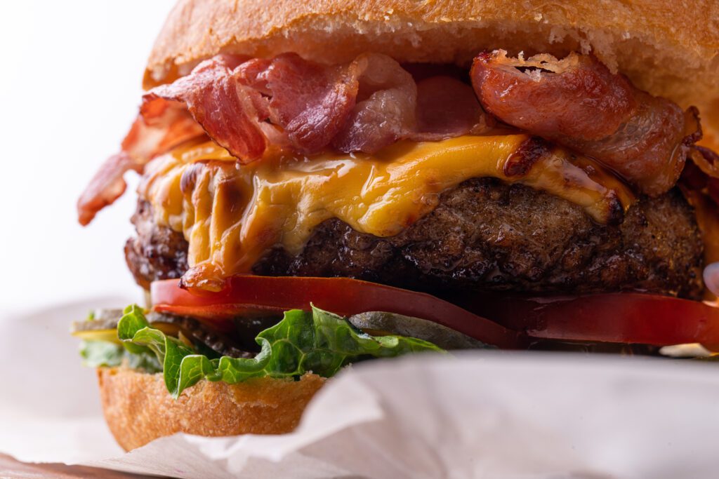 fresh tasty burger on wood table